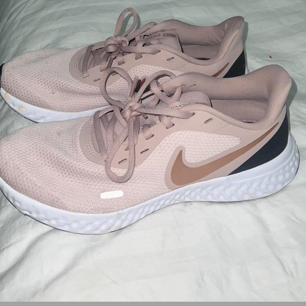 Nike Revolution running shoes in pink and white
